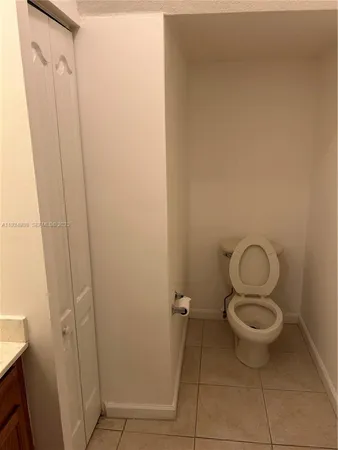 a bathroom with a toilet and a sink