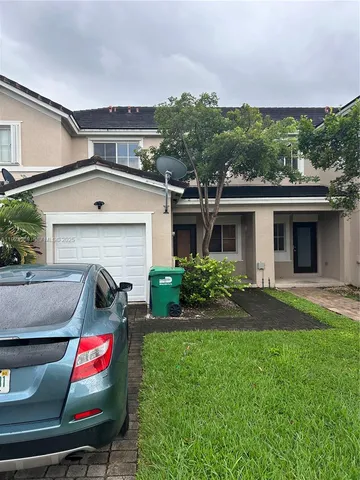 a view of house with outdoor space and seating space