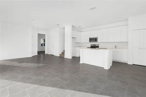 a view of a kitchen with a sink