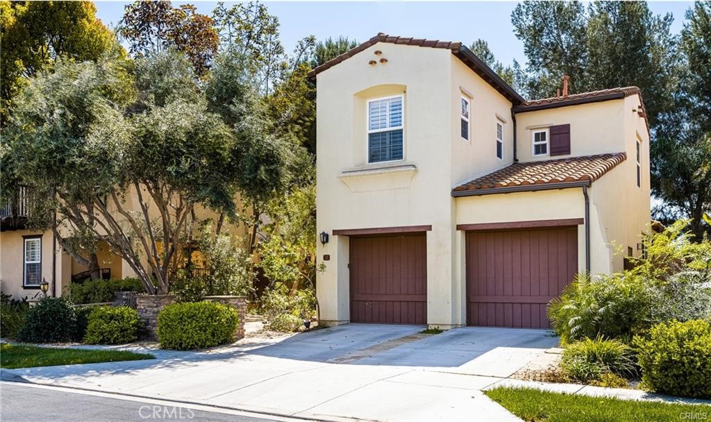28 Secret Garden Irvine, CA 92620 - Photo 1 of 38 a front view of a house with a yard