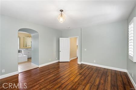 28 Secret Garden Irvine, CA 92620 - Photo 11 of 38 an empty room with wooden floor and windows