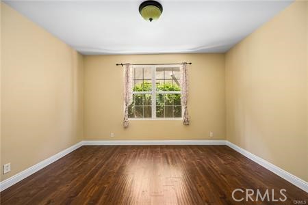 28 Secret Garden Irvine, CA 92620 - Photo 16 of 38 an empty room with wooden floor and windows