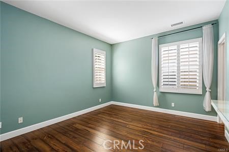 28 Secret Garden Irvine, CA 92620 - Photo 17 of 38 a view of a room with wooden floor and windows
