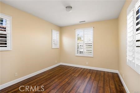 28 Secret Garden Irvine, CA 92620 - Photo 19 of 38 an empty room with wooden floor and windows