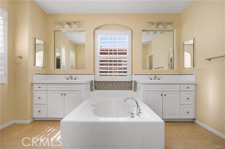 28 Secret Garden Irvine, CA 92620 - Photo 22 of 38 a bathroom with a sink and a bathtub