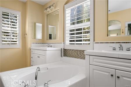 28 Secret Garden Irvine, CA 92620 - Photo 23 of 38 a bathroom with a sink and a bathtub