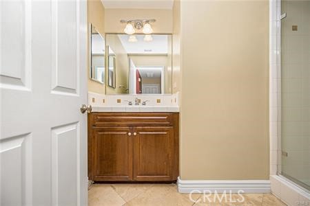 28 Secret Garden Irvine, CA 92620 - Photo 25 of 38 a bathroom with a sink vanity and a mirror