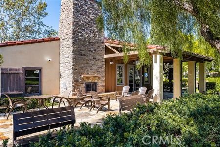 28 Secret Garden Irvine, CA 92620 - Photo 31 of 38 a view of a patio with chairs and potted plants