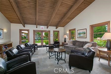 28 Secret Garden Irvine, CA 92620 - Photo 32 of 38 a living room with furniture ceiling fan and a large window
