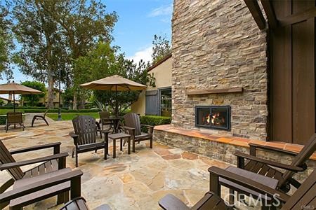 28 Secret Garden Irvine, CA 92620 - Photo 34 of 38 a view of a patio with chairs and tables