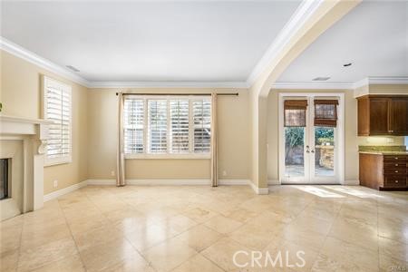 28 Secret Garden Irvine, CA 92620 - Photo 4 of 38 a view of an empty room with a fireplace and a window
