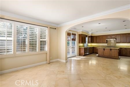 28 Secret Garden Irvine, CA 92620 - Photo 7 of 38 a large white kitchen with a large window