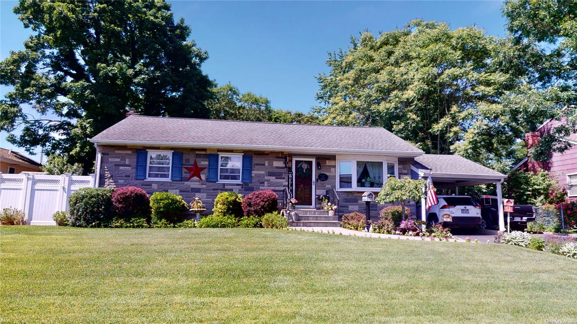 51 Jay Road Centereach, NY 11720 - Photo 1 of 1 a front view of a house with garden