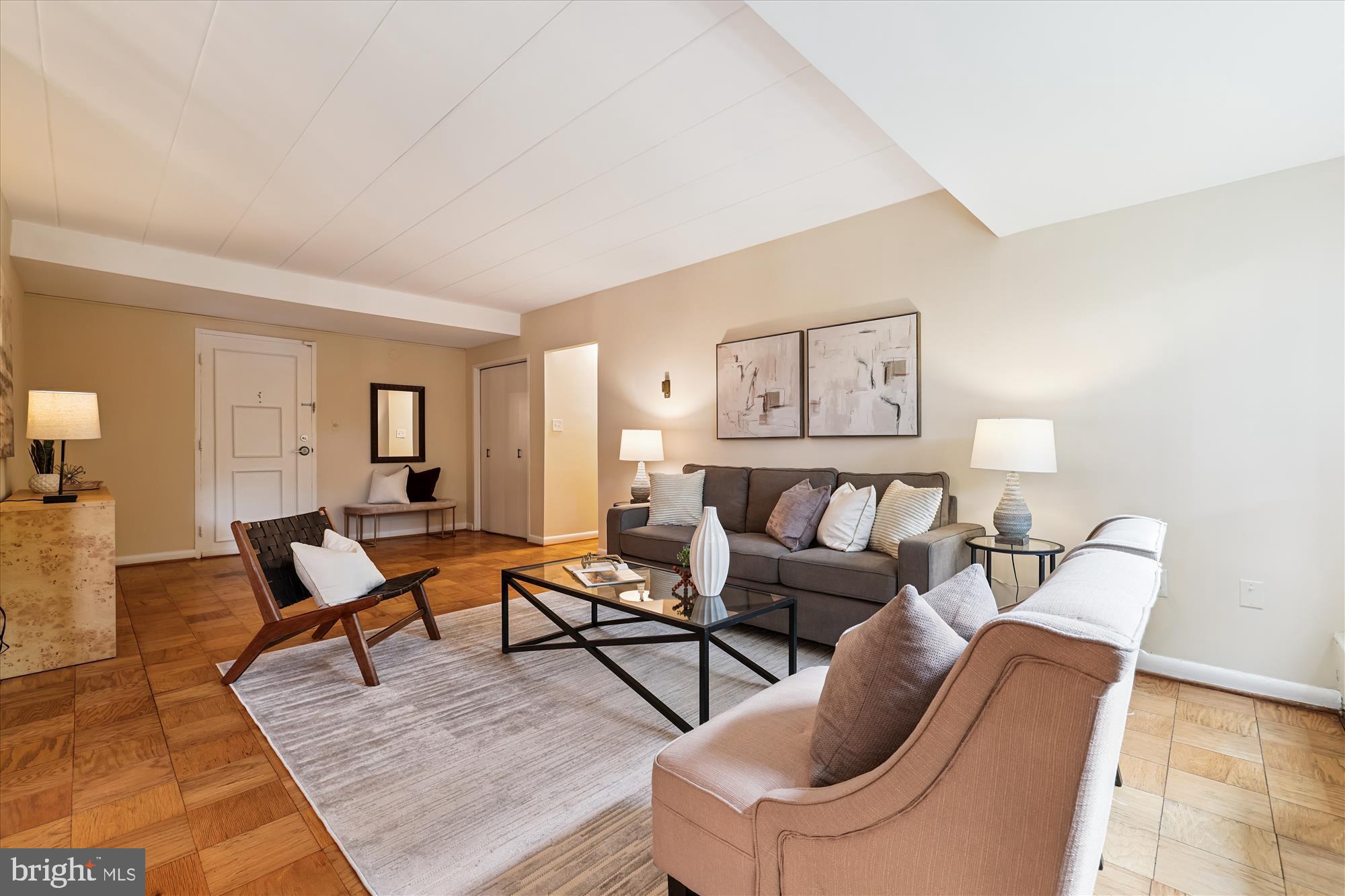 4800 Chevy Chase Drive, Unit 101 Chevy Chase, MD 20815 - Photo 3 of 17 a living room with furniture and wooden floor