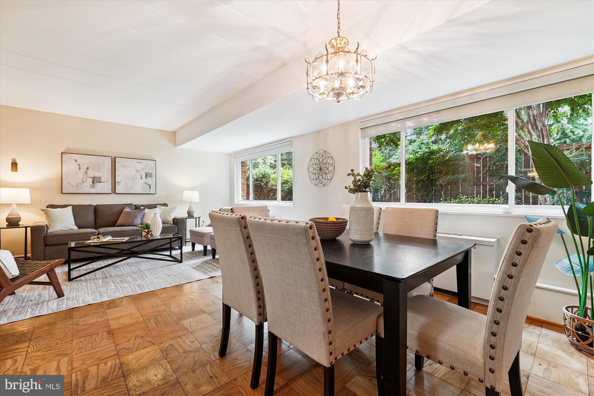 4800 Chevy Chase Drive, Unit 101 Chevy Chase, MD 20815 - Photo 4 of 17 a view of a dining room with furniture window and outside view