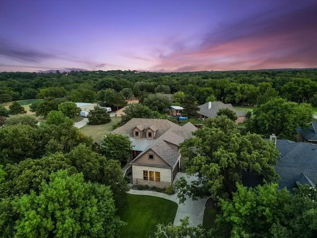 a aerial view of a house with a yard