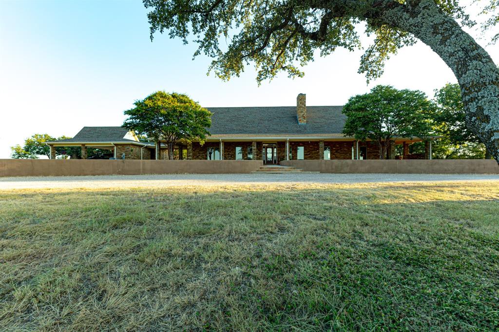 12300 County Road 367 May, TX 76857 - Photo 2 of 40 an aerial view of residential houses with outdoor space and trees