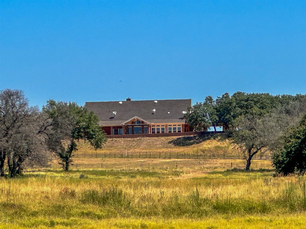 12300 County Road 367 May, TX 76857 - Photo 22 of 40 a view of swimming pool and mountain in the back
