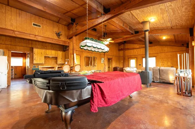 a bedroom with furniture and a chandelier