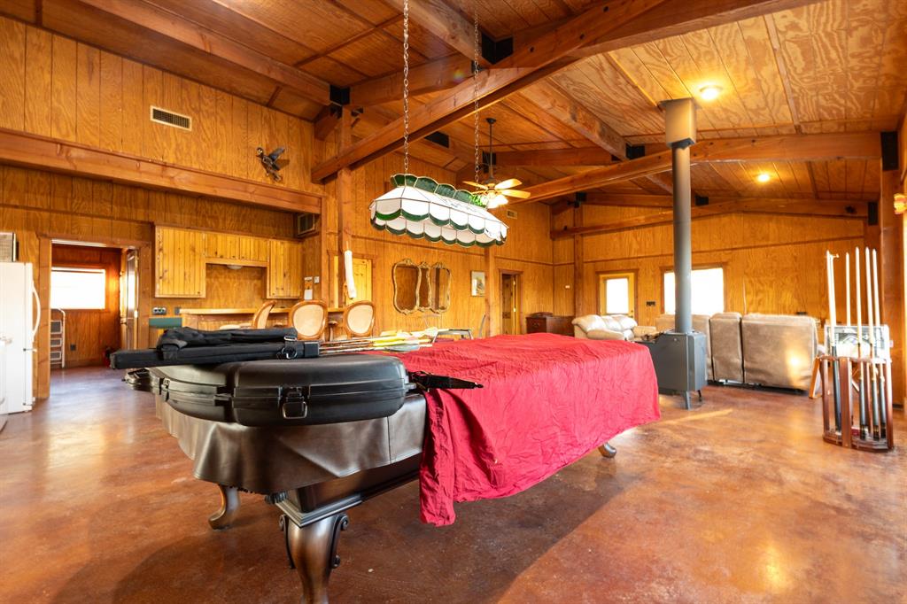 12300 County Road 367 May, TX 76857 - Photo 31 of 40 a bedroom with furniture and a chandelier