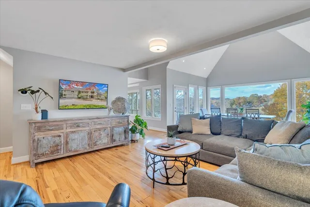 a view of mountain with sunset in background