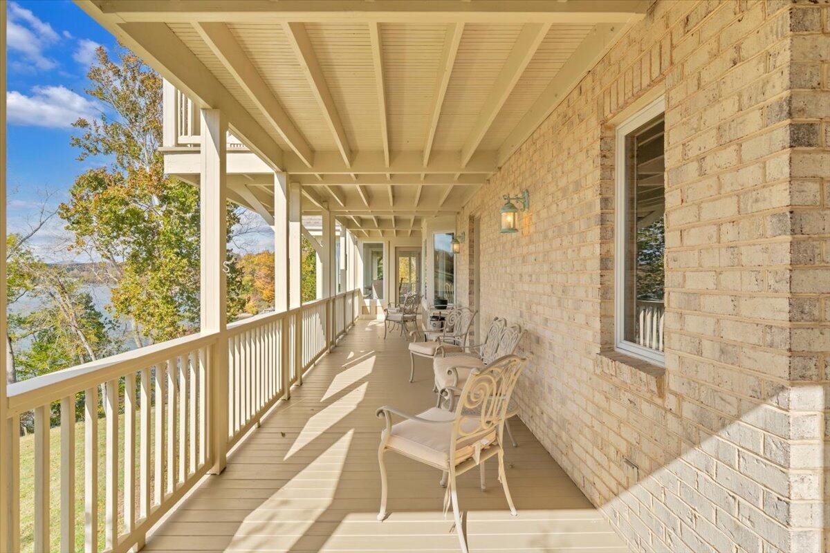6641 Horseshoe Bend Road Goodview, VA 24095 - Photo 57 of 181 a view of an chairs and table in the balcony