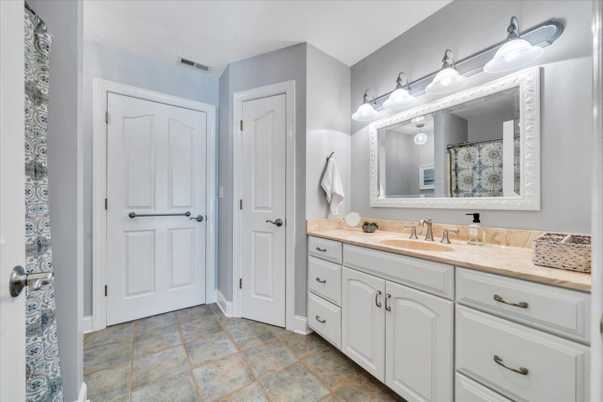 6641 Horseshoe Bend Road Goodview, VA 24095 - Photo 91 of 181 a bathroom with a double vanity sink mirror and