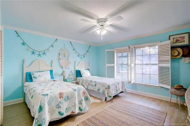 a living room with furniture a fireplace and a chandelier