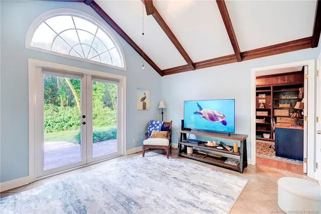 a outdoor space with lots of tables a chandelier and living room view
