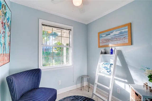 a view of a patio with table and chairs under an umbrella