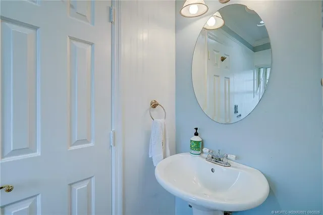 a view of a patio with a table and chairs under an umbrella