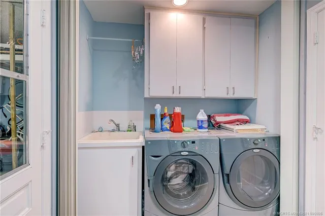 a view of a house with a sitting area and garden