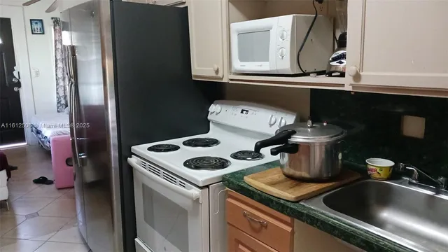 a kitchen with a stove and a sink