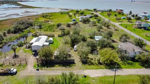 a view of a swimming pool and an outdoor seating