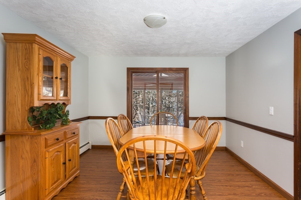 75 Jordan Road Franklin, MA 02038 - Photo 11 of 46 a view of a dining room with furniture window and wooden floor
