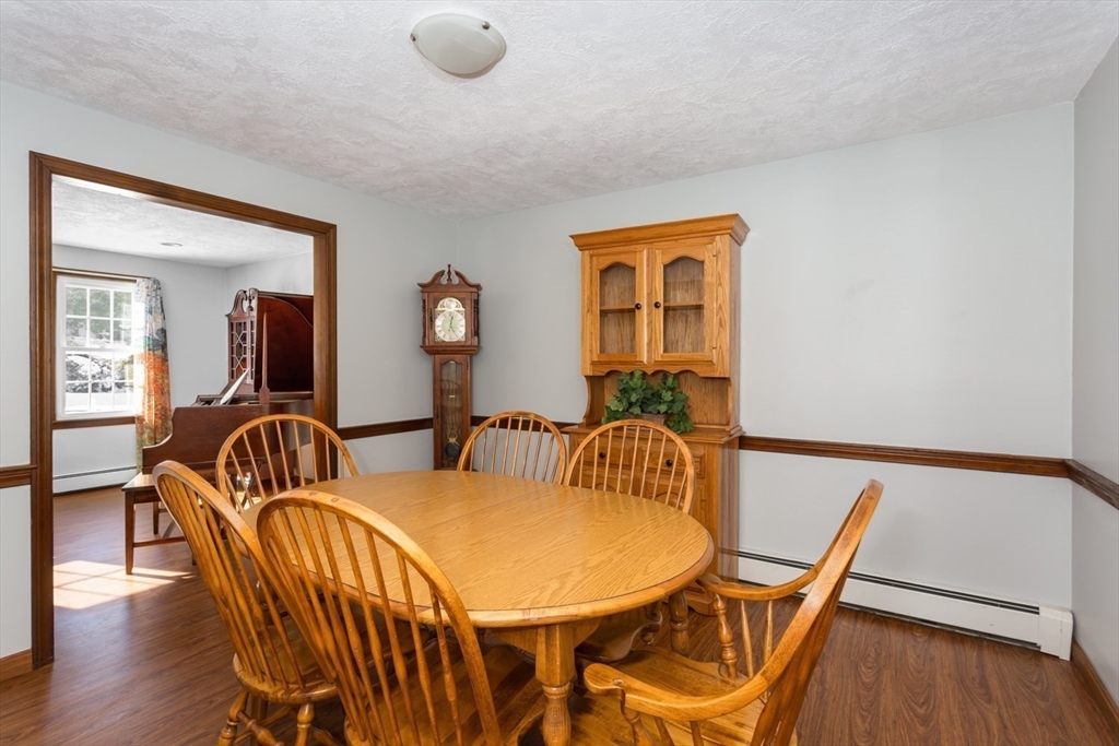 75 Jordan Road Franklin, MA 02038 - Photo 12 of 46 a view of a dining room with furniture and wooden floor