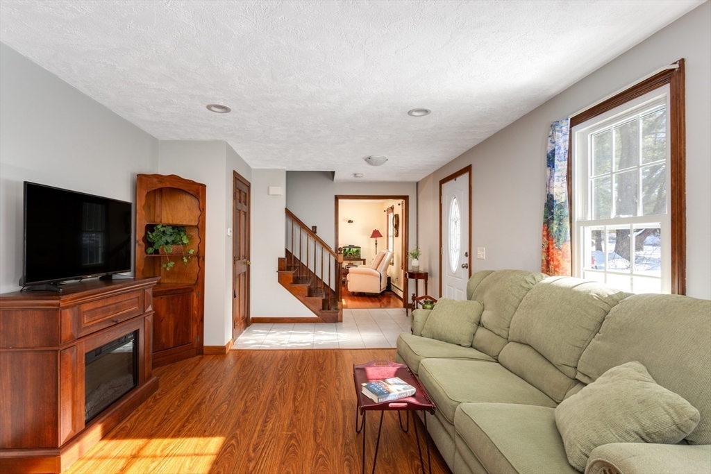 75 Jordan Road Franklin, MA 02038 - Photo 15 of 46 a living room with furniture and a flat screen tv