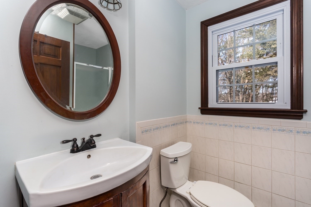 75 Jordan Road Franklin, MA 02038 - Photo 17 of 46 a bathroom with a toilet a sink and a mirror