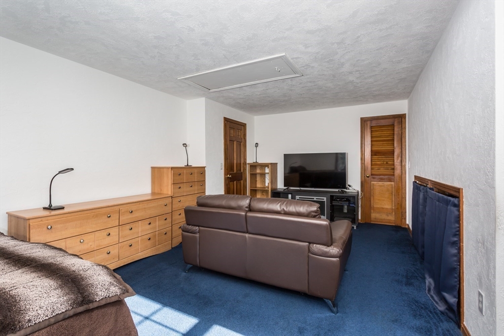 75 Jordan Road Franklin, MA 02038 - Photo 22 of 46 a living room with furniture and a flat screen tv