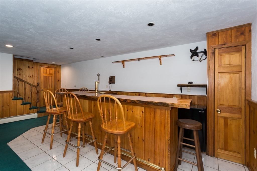 75 Jordan Road Franklin, MA 02038 - Photo 25 of 46 a kitchen with stainless steel appliances granite countertop a table chairs and a refrigerator