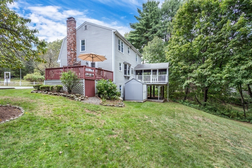 75 Jordan Road Franklin, MA 02038 - Photo 36 of 46 front view of house with a yard and potted plants