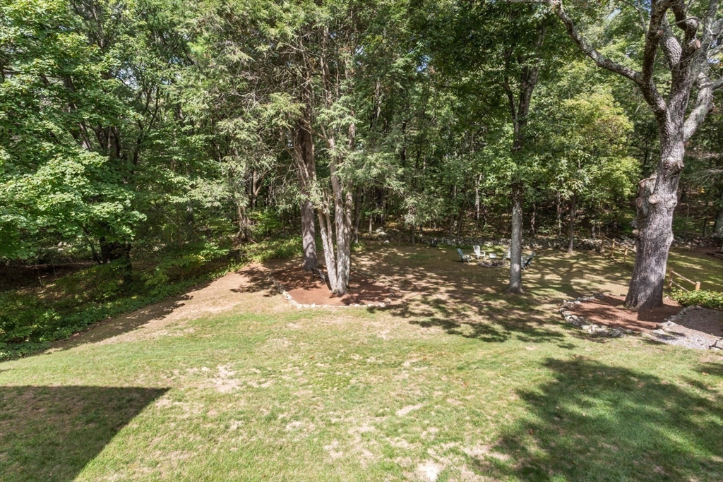 75 Jordan Road Franklin, MA 02038 - Photo 6 of 46 a view of a tree with a yard