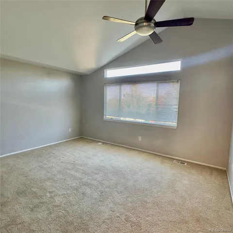 an empty room with a empty space and windows