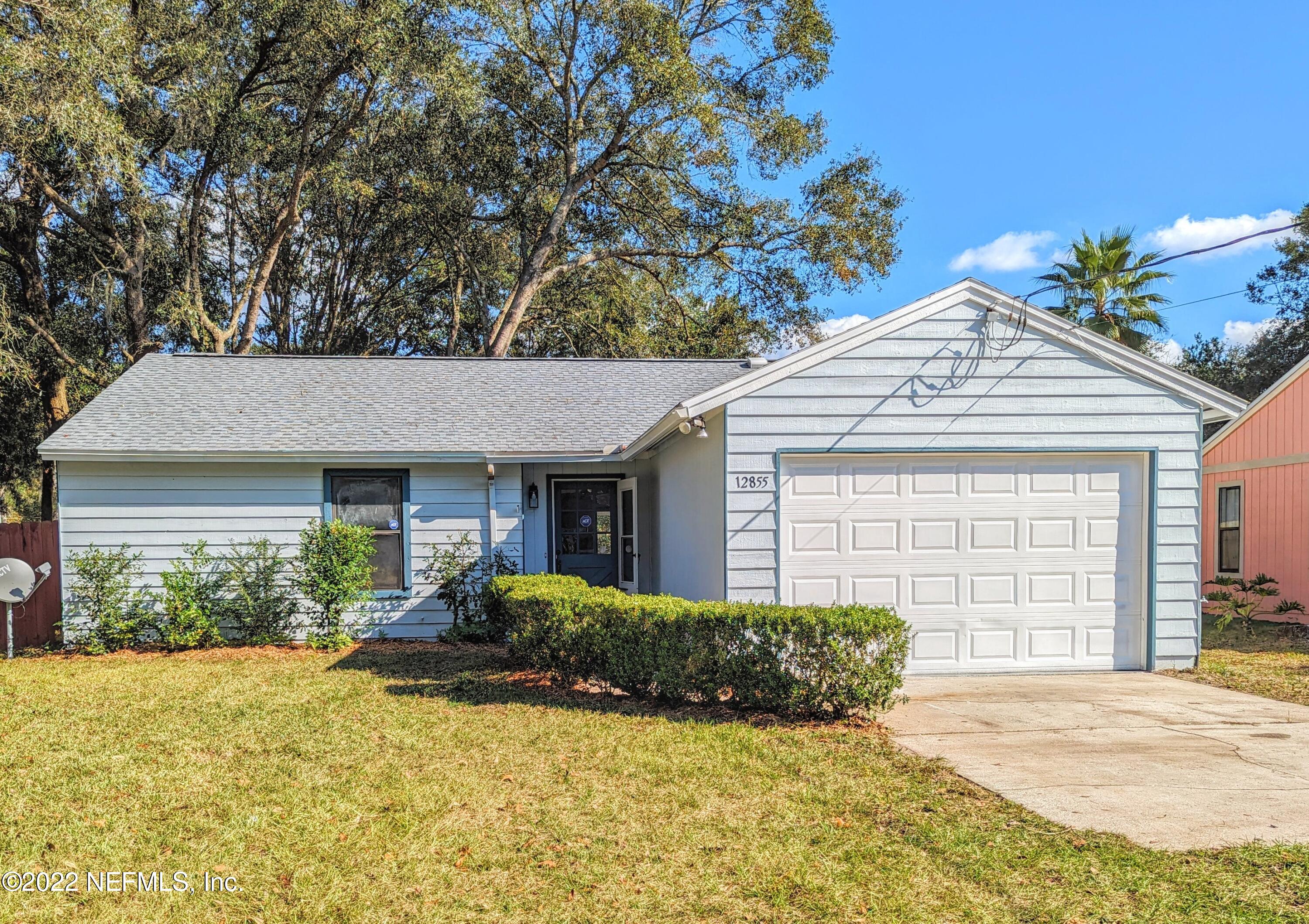 12855 Attrill Road Jacksonville, FL 32258 - Photo 1 of 16 a front view of a house with garden
