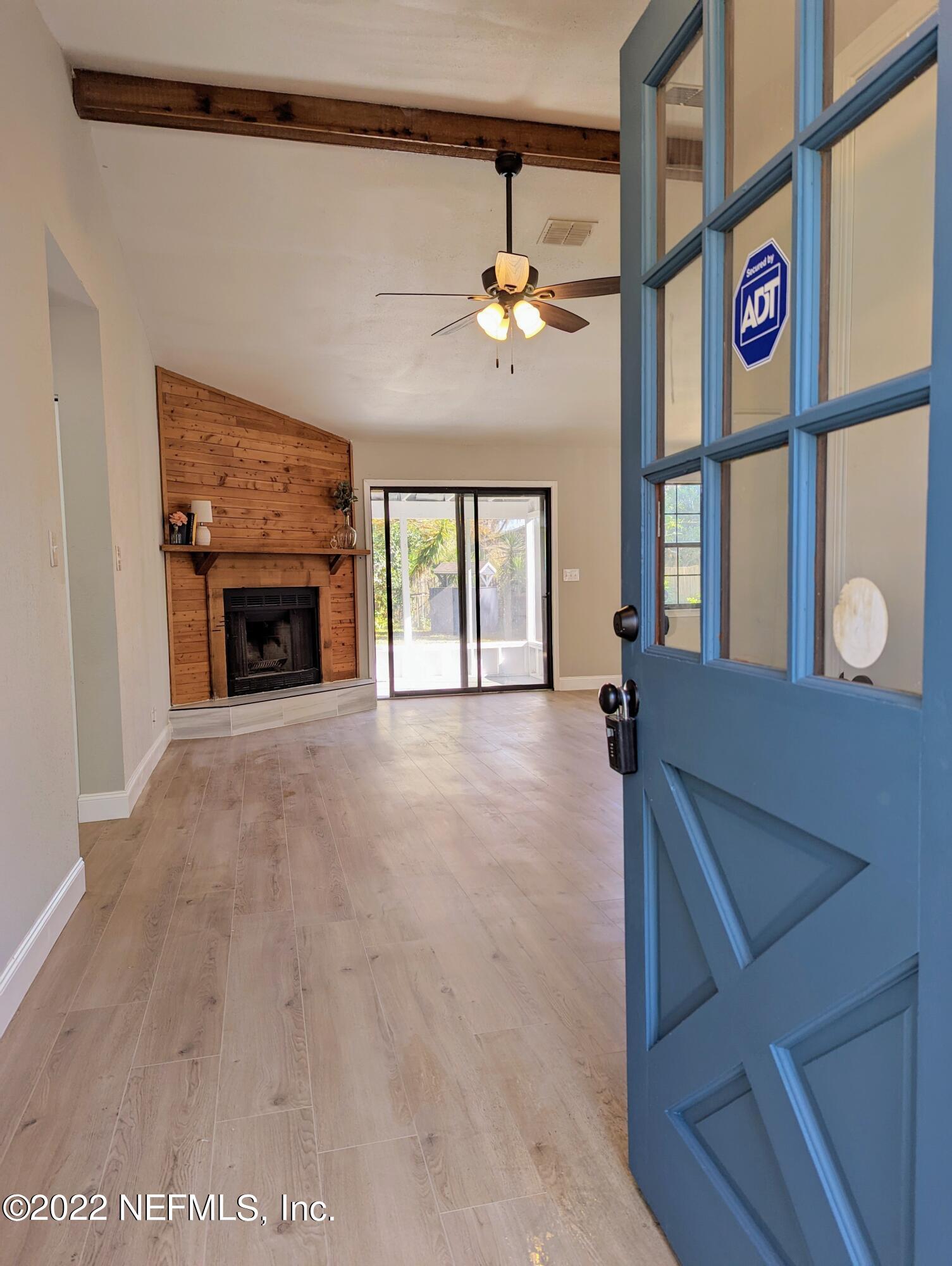 12855 Attrill Road Jacksonville, FL 32258 - Photo 3 of 16 a view of an entryway with a fireplace
