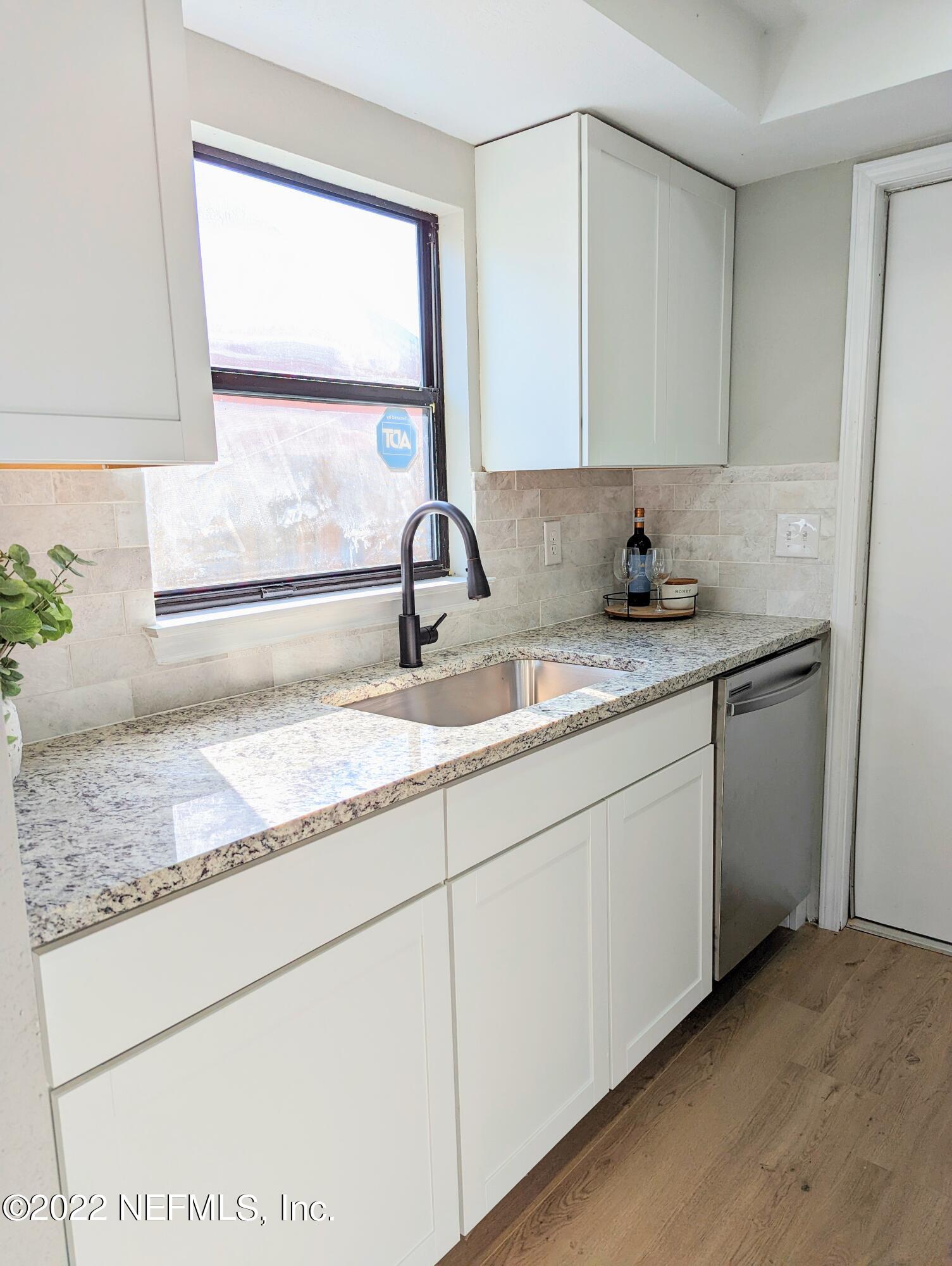 12855 Attrill Road Jacksonville, FL 32258 - Photo 5 of 16 a bathroom with a granite countertop sink and a mirror