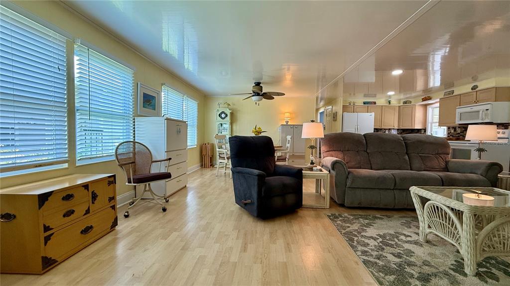 716 Blackburn Boulevard North Port, FL 34287 - Photo 15 of 48 a living room with furniture and a flat screen tv