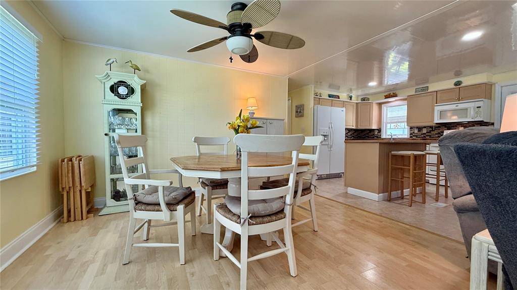 716 Blackburn Boulevard North Port, FL 34287 - Photo 16 of 48 a view of a dining room with furniture and wooden floor