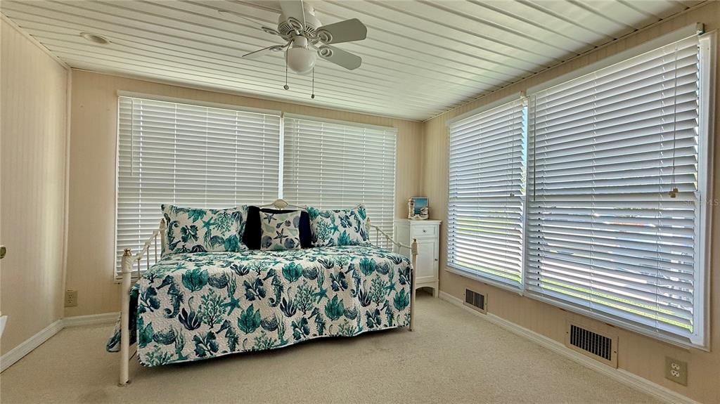716 Blackburn Boulevard North Port, FL 34287 - Photo 18 of 48 a bedroom with a bed and a window