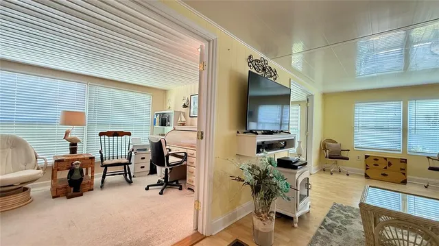 a view of a livingroom with furniture and windows